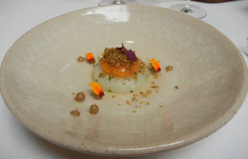 Squid Tartare with liquid egg yolk, onion and kaffir consommé