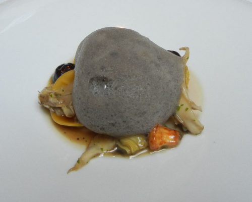 Black truffle glazed Hare ravioli with sautéed artichokes and trompette mushroom